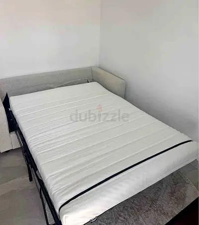 fabric sofa bed pulls out into double bed, good condition