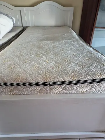 White wooden single bed frame with mattress included