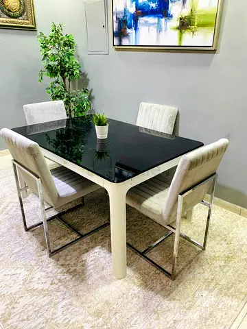Modern 4-Seater Dining Table with Black Glass Top and Upholstered Chairs