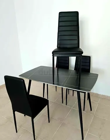 Black modern 4-seater dining table with 4 high-back chairs