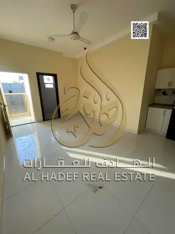 A premium studio for rent in Al Ayelia, Ajman, featuring spacious interiors and great natural light. It includes a balcony with beautiful views, makin