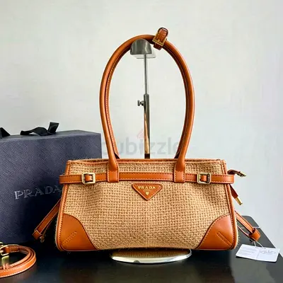 Prada woven straw tote bag with leather trim