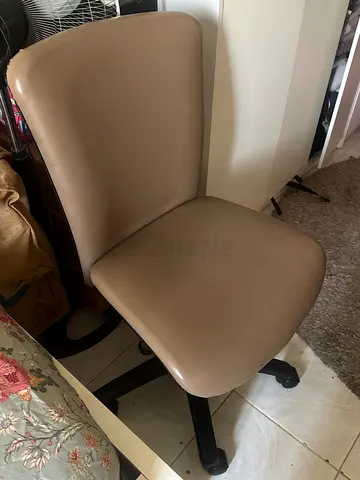 Beige office desk chair on wheels - good used condition