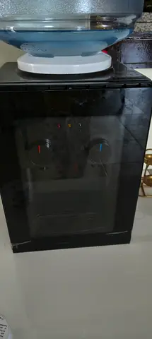 Small countertop hot / cold water dispenser.