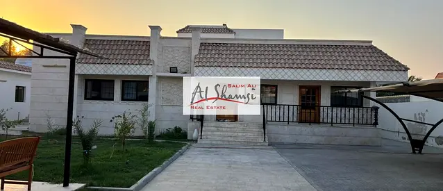 Villa for sale in Al-Khuzamiyah, featuring a swimming pool; 12,200 sq. ft.