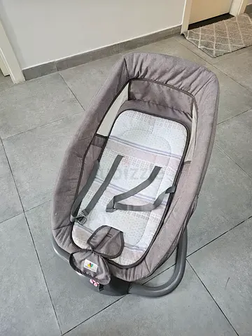 Lightly used baby rocker / bouncer with safety straps