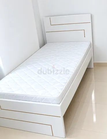Brand new single size wood bed including mattress available