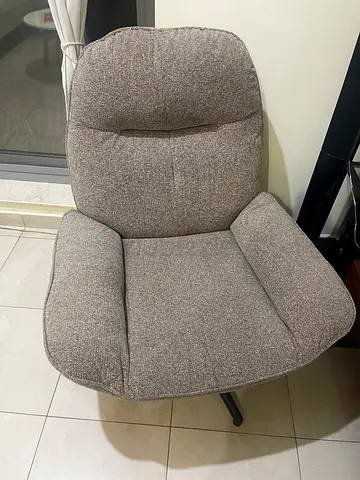 Comfortable grey upholstered lounge chair - good condition