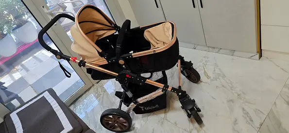 Used beige/black pram stroller with bassinet - good condition