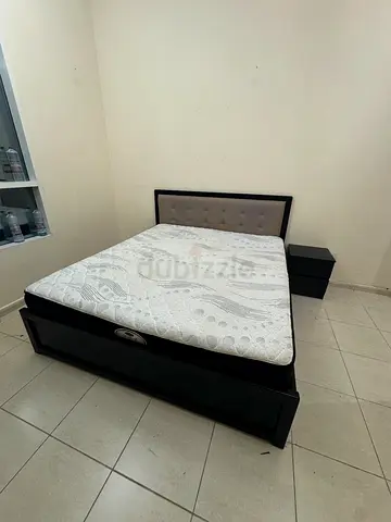 King size bed frame with medical mattress and nightstand - dark wood