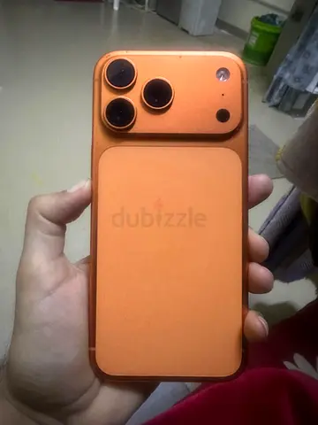 Used iPhone with orange protective case (no visible brand on back)