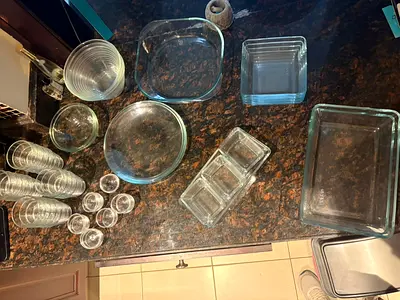 Large collection of 52 IKEA glass dishes and bowls in assorted sizes