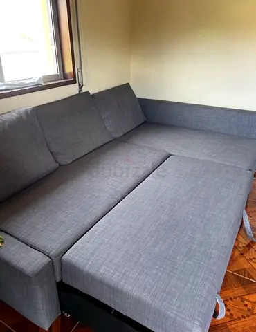 Large L-shaped grey fabric sofa bed — good condition