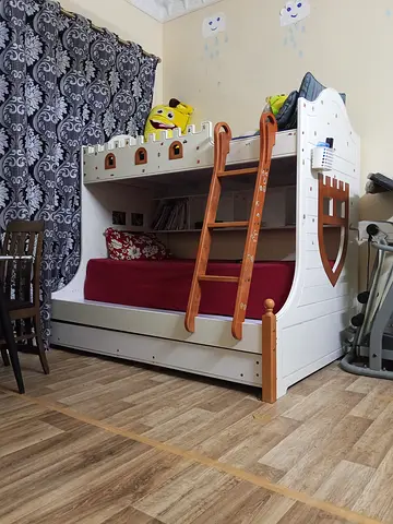 Wooden castle-themed bunk bed with trundle — good condition