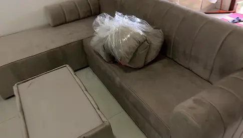 L-shaped beige velvet sofa with ottoman - good condition