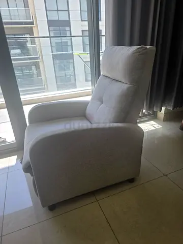 Light grey upholstered lounge armchair - single comfy seat