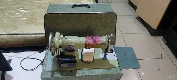 Vintage portable electric sewing machine with case