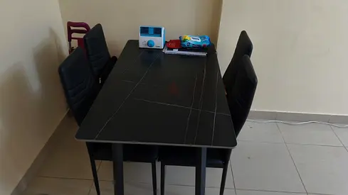 Black dining table with 4 chairs - modern set, good condition