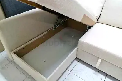 Beige L-shaped sofa with under-seat storage (corner sofa)