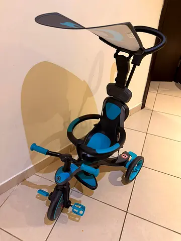 Convertible toddler tricycle with parent push handle and sun canopy