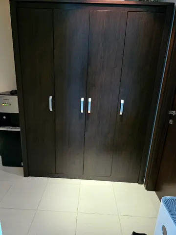 Dark Wood 4-Drawer Wardrobe / Armoire in Good Condition