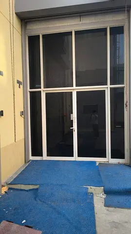 Glass storefront door with aluminum frame — ready for commercial use