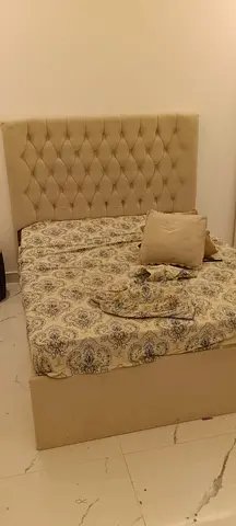Tufted double bed