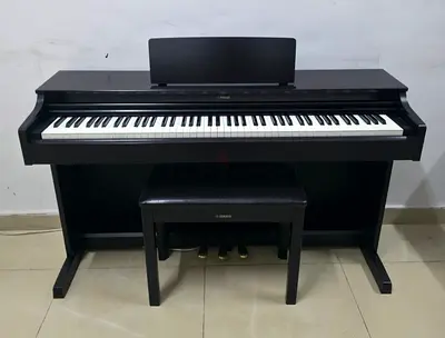 The Yamaha Arius YDP-163R (Dark Rosewood) is an 88-key console digital piano featuring Graded Hammer