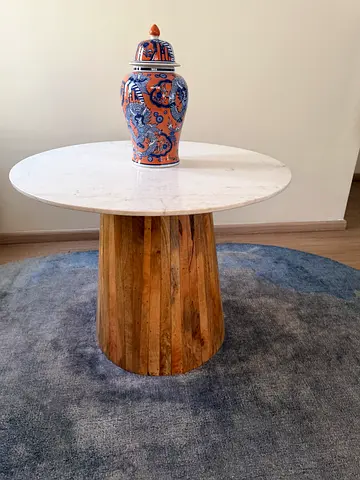 Round wooden coffee table with white top