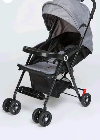 Lightweight grey baby stroller with canopy and storage basket