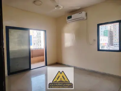 2BR apartment in Al Nuaimiya 1, behind Thumbay Hospital, balcony, 2 baths, AED 28,007 yearly.