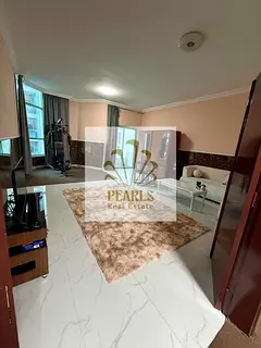 Available for annual rent in Al Khor Towers: a spacious unit featuring two bedrooms, a living room,