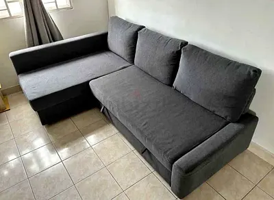 Dark grey L-shaped sofa with chaise - good condition