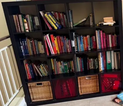 Large Kallax-style Bookshelf with Assorted Books and Storage Bins