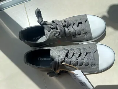 Reebok grey canvas low-top sneakers, brand new with tags, size unstated