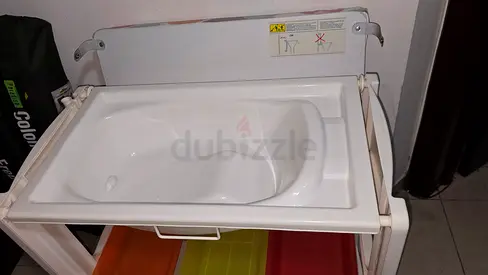 Foldable baby changing station table with built-in bathtub