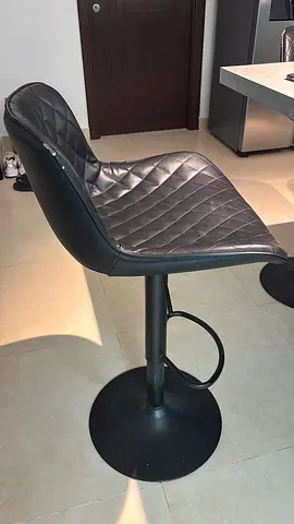 Black adjustable quilted bar stool with footrest