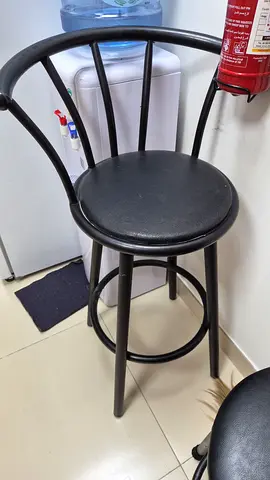 simple black metal bar stools with round seats