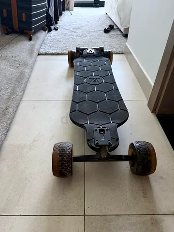Used off-road electric longboard with large all-terrain wheels