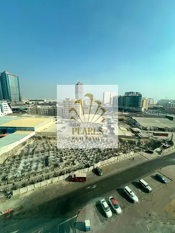 Spacious 2BHK: open view, 2 balconies, fitted kitchen, 2 baths, parking, free maintenance, near transit, best price in Ajman.