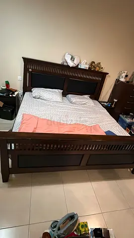 Dark wood queen bed frame with headboard and footboard - good condition