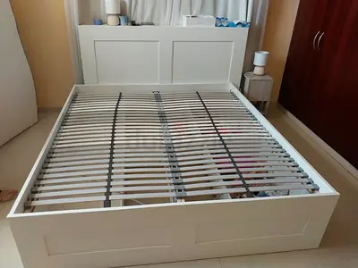 White wooden double bed frame with slats - good condition Selling a good-quality used bed like new