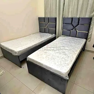 Pair of Twin Size Beds with Velvet Padded Headboards