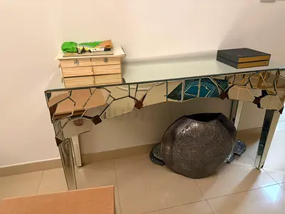 Glass modern mirrored console table with a mosaic or puzzle cut mirror design