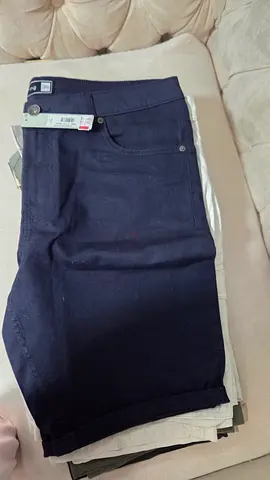 Dark navy casual trousers, size tag visible 34 Neww