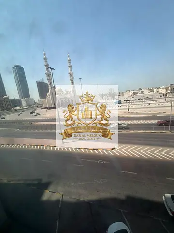 For Sale – Prime Investment Building in Al Majaz 3; Area: 21,013 sq. ft.; Annual Income: AED 5,100,000.