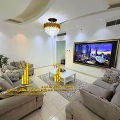 An ultra-luxurious 2-bedroom apartment with a living room at Orient Towers—featuring a gym, pool, 