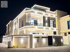 A luxurious villa in **Al Helio 2 – Ajman**, ready for immediate occupancy, featuring high-end fin