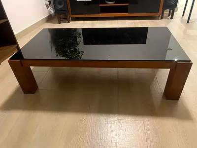 MOVING OUT: Solid wood coffee table with black glass top, 138 x 68 cm