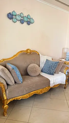 Classic gold-trimmed vintage sofa in good condition